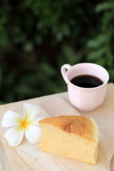 Pieces of Japanese style Cheesecake and cup of black coffee with