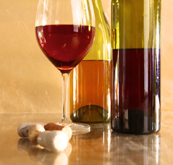 on the table a bottle of wine and a glass of