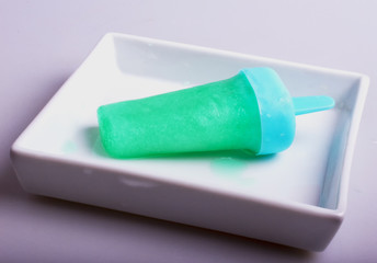 Popsicle mint in white plate
