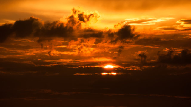 Fototapeta Red sunset sky stormy clouds.