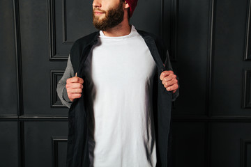 white blank t-shirt with space for your logo on a hipster man wi