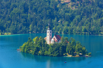 Fototapeta na wymiar Aerial view on the island on emerald alpine lake Bled, Slovenia – nature travel background