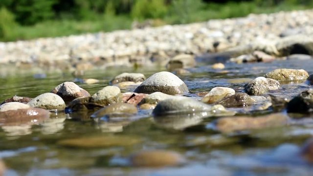 Natural river flow between stones