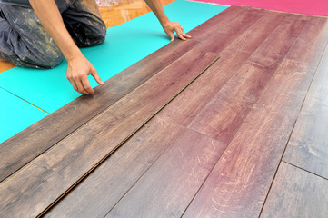 Carpenter doing laminate floor work