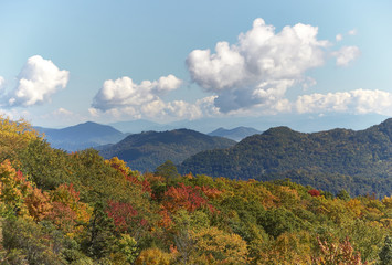 View over Blue Ridge Mountains in indian summer with red, green and yellow colored treetops, North Carolina, U.S.A.