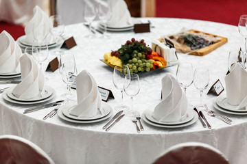 Round restaurant table served luxury for a festive dinner