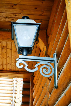 Vintage lantern on a wooden wall