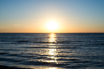 Blurry sunrise above the sea. May be blurry sunset. Excellent bokeh.