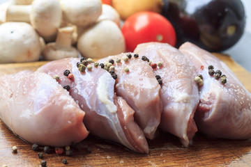 Raw duck on a wooden Board in the cooking process