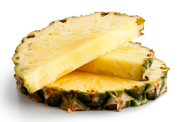 Round pineapple slice and two halves with skin isolated on white