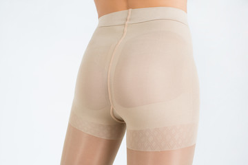 Female buttocks in tights on white background