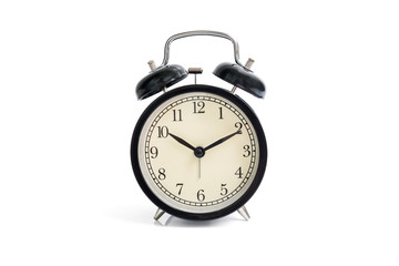 Isolated black vintage alarm clock on white background