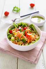 Fresh healthy thai spicy salmon salad mixed vegetable and herb