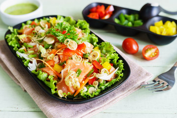 Fresh healthy thai spicy salmon salad mixed vegetable and herb