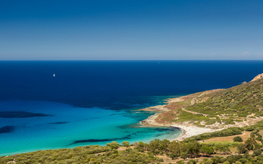Holidaymakers and aquamarine mediterranean at Bodri beach in Cor
