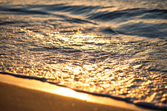Sunrise in the sea with soft wave