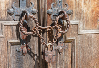 Lock and chain on an old door. Vintage