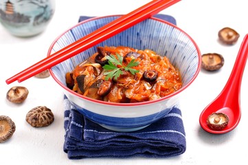 Cabbage stew with zucchini, onions, garlic, ginger and shiitake mushrooms in a spicy tomato sauce.