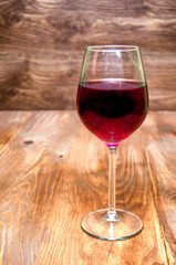 Wine glass on a wooden background