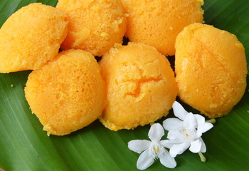 toddy palm cake Thai dessert and cape jasmine on banana leaf
