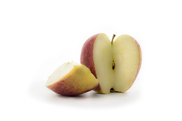 sliced big red apple with slice on a white background (water dro