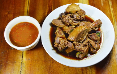 steamed duck meat in Chinese brown soup with spicy and sour sauce