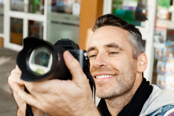 Male photographer taking picture