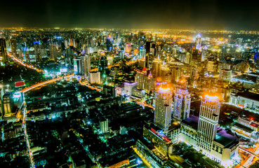 Fototapeta na wymiar view over the big asian city of Bangkok , Thailand at nighttime when the tall skyscrapers are illuminated