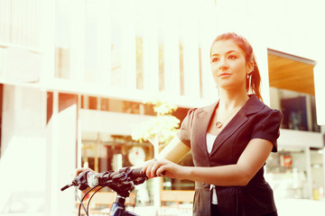 Young woman commuting on bicycle