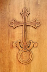 The cross on the wooden door.