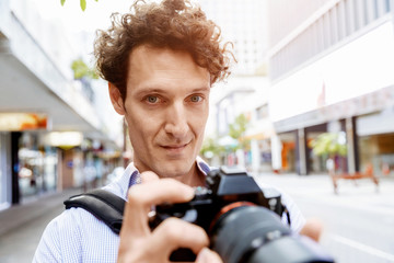 Male photographer taking picture