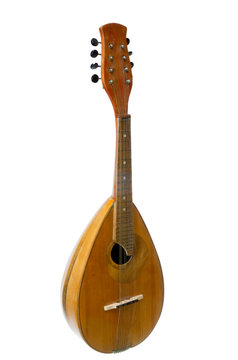Mandolin on a white background, old musical instrument.