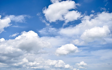 Naklejka na ściany i meble Puffy Clouds against a Blue Sky