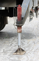 Truck strong outrigger stabilizing legs extended. Working leg  from a crane.