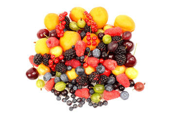 lots of fresh different berries on a white background