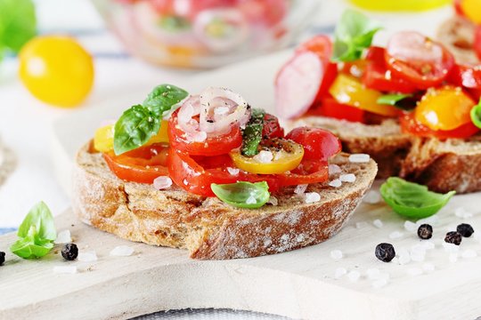 Traditional Italian bruschetta with tomatoes,shallot and basil. Selective focus 
