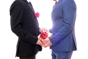 Gay couple having a gift and a rose 