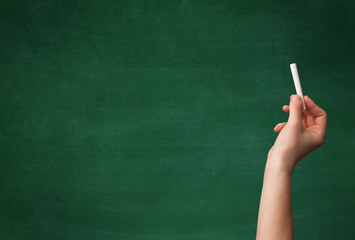 Hand writing on clean blackboard