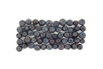 blueberries are laid out in rows on a white background