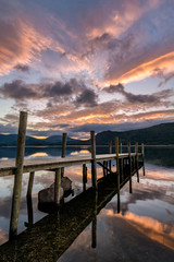 Dramatic sunrise over Brandlehow Jetty in the Lake District, UK.