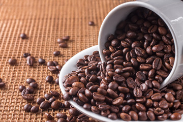 Cup full of coffee beans