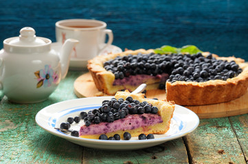 Yummy homemade open pie with cream cheese filling and fresh foreground