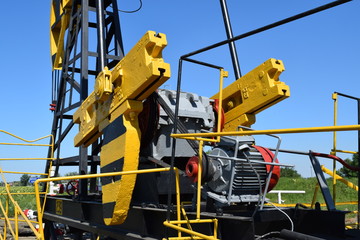 Balance weight and reducer the pumping unit of an oil well.