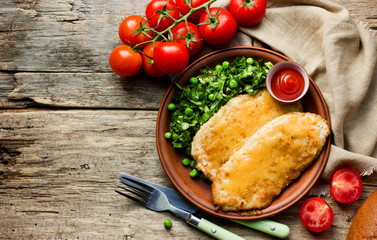 Chicken schnitzel with cheese or cordon bleu with green salad