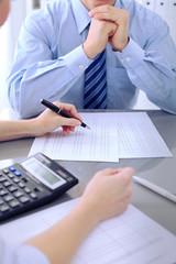Bookkeepers or financial inspector making report, calculating or checking balance. Audit concept.