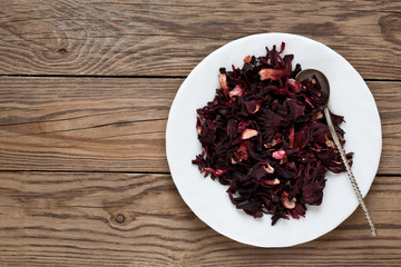 Hibiscus leaves on a plate with a spoon