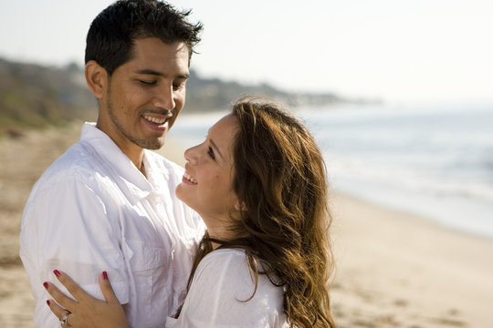 Hispanic couple at the beach.