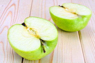 Green Apple on Light Wooden Background