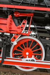 Fototapeta na wymiar Detail and close up of huge wheels at one old german steam locom