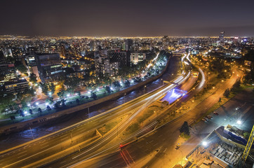 Fototapeta na wymiar The skyline of Santiago de Chile by night.